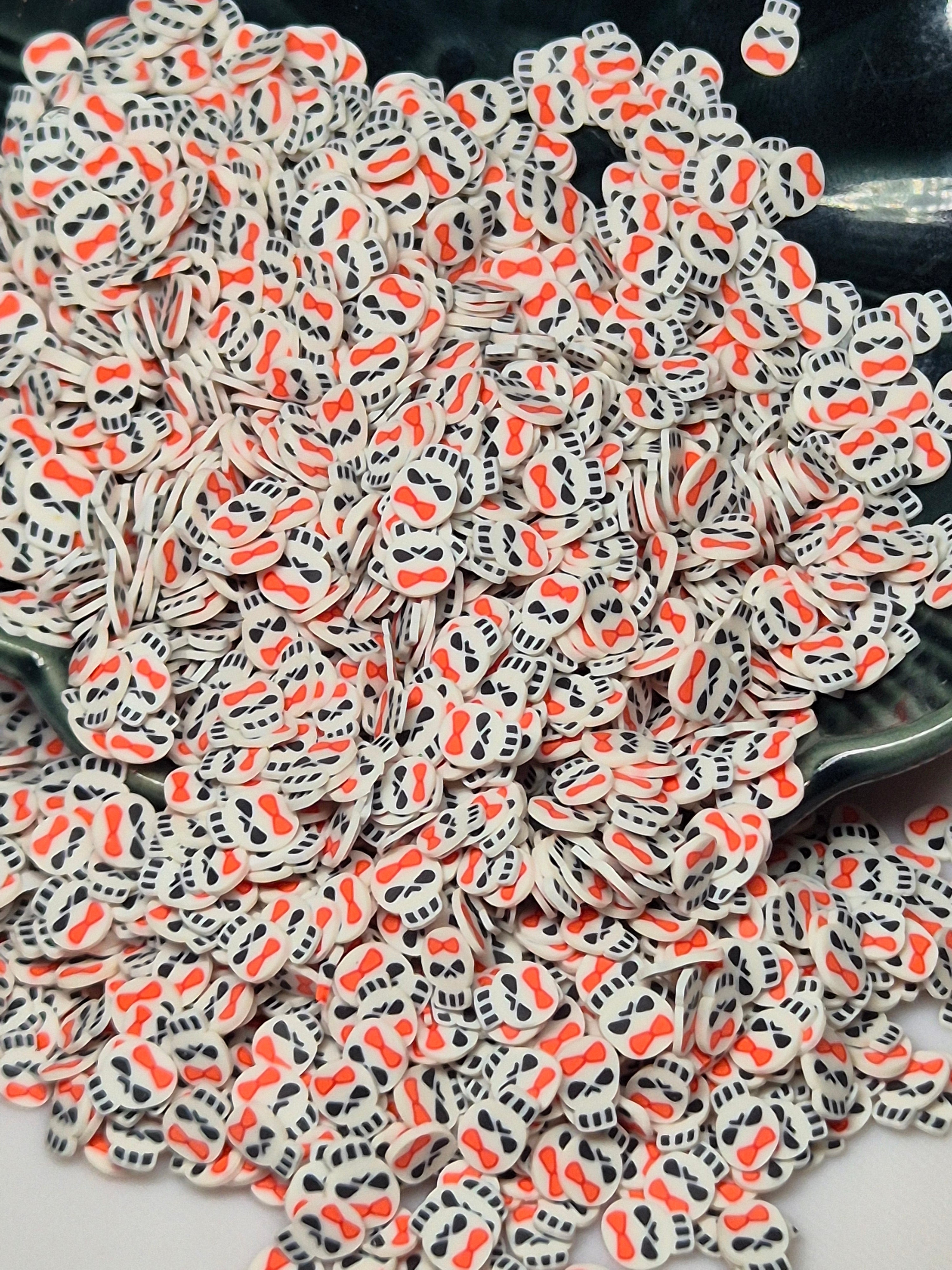 CLAY PIECES SKULL WITH BOW